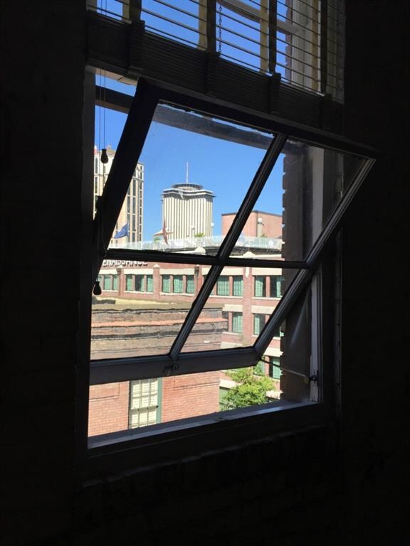 Windows open to city views, including the World Tr