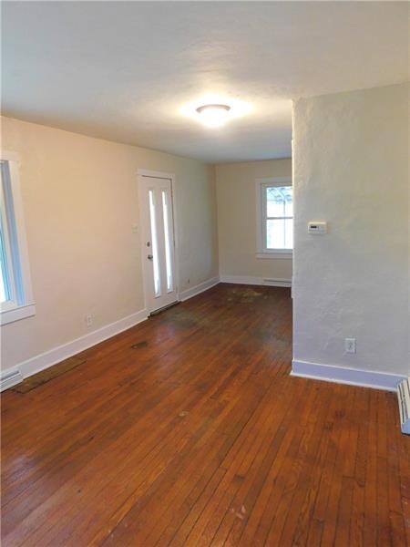 View of the living room and front door. Plenty of 