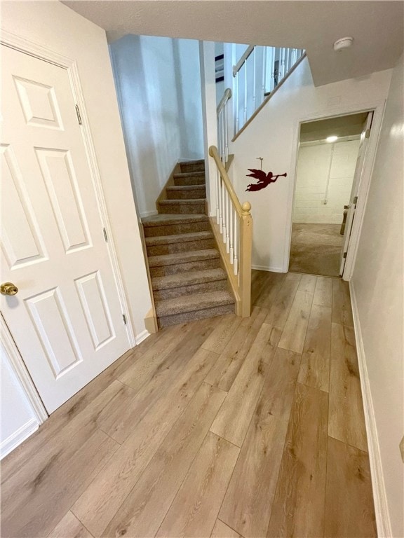 New Laminate Flooring leading upstairs or to the