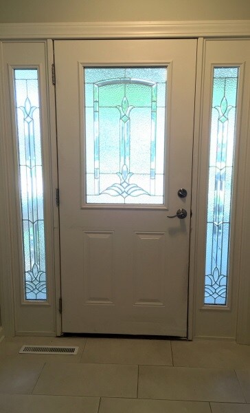 Beautiful front door with side lights that allow l