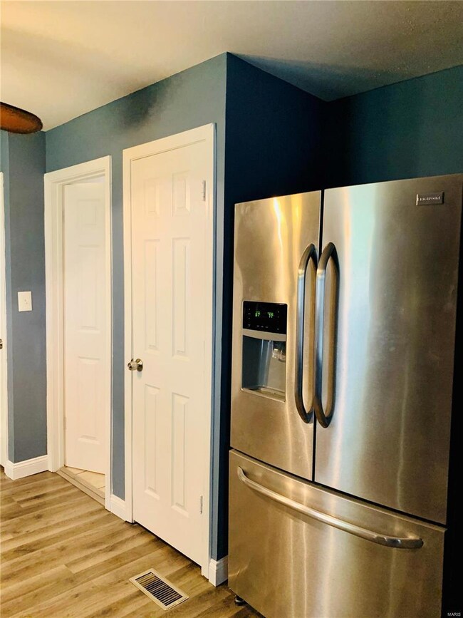 New stainless refrigerator offered with purchase! Seller wants you to have a complete kitchen. SWEET!!! New 6 panel doors too. Far left door is bathroom, middle door is pantry.