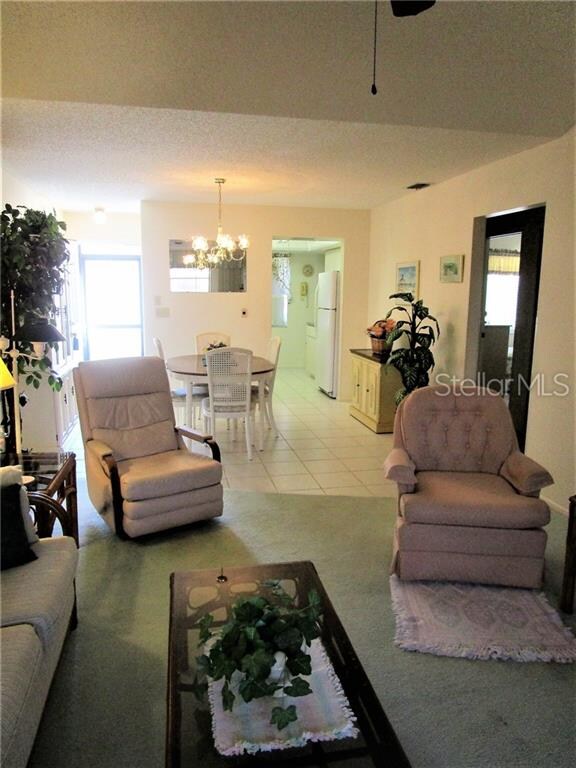 Living room has sliding glass doors to Lanai which