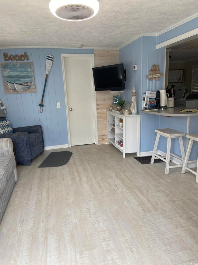 Living room featuring light hardwood / wood-style 