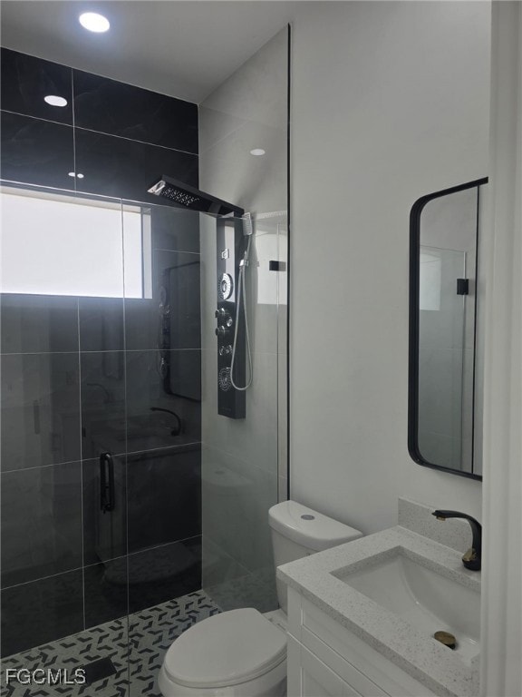 Bathroom with vanity and a stall shower