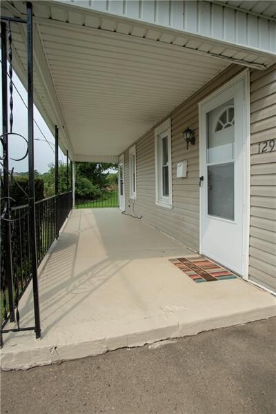 Great view of covered front porch.  Finished ceili