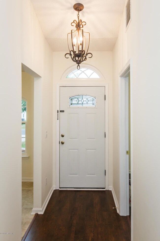 Front Entry w Beautiful Light Fixture