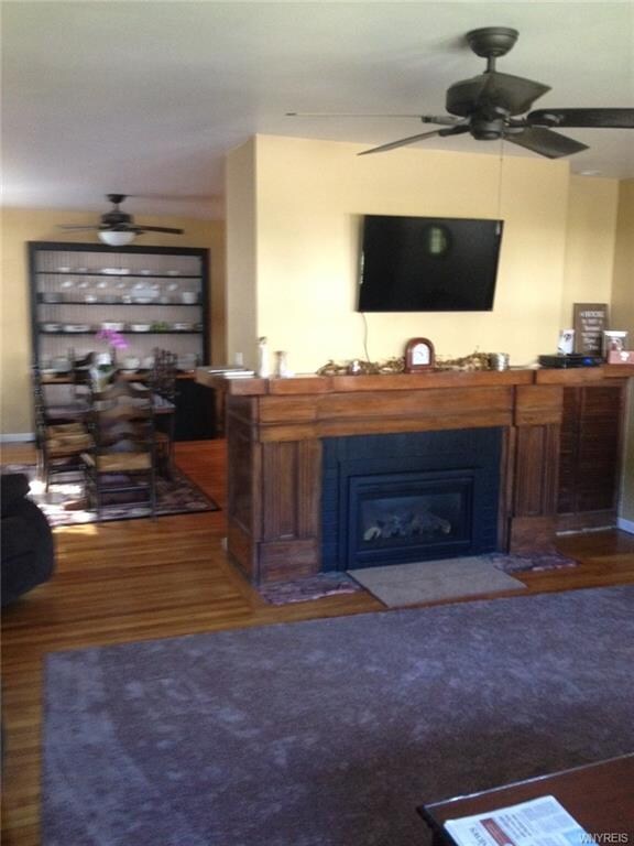 Living room has Fireplace with gas insert updated 