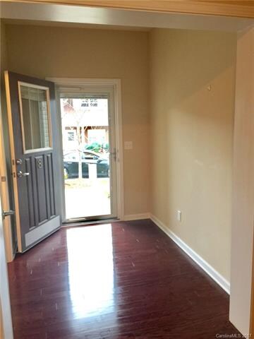 Foyer, 1/2 bath. Storm door