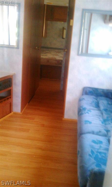 Laminate flooring,,bath on the left and bedroom