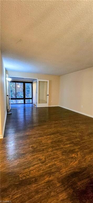 Laminate floors throughout - Living/dining view toward sunroom