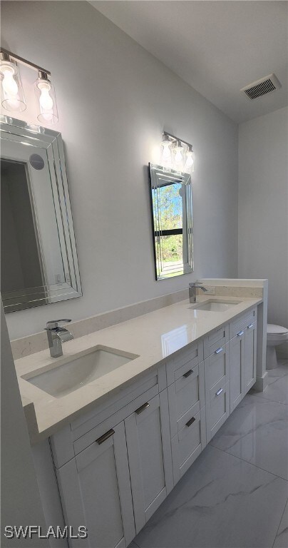 Master Bathroom featuring vanity and toilet