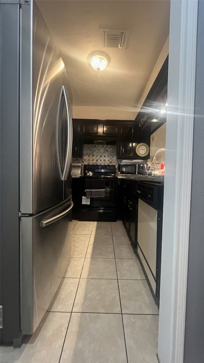 Tiled kitchen with granite countertops