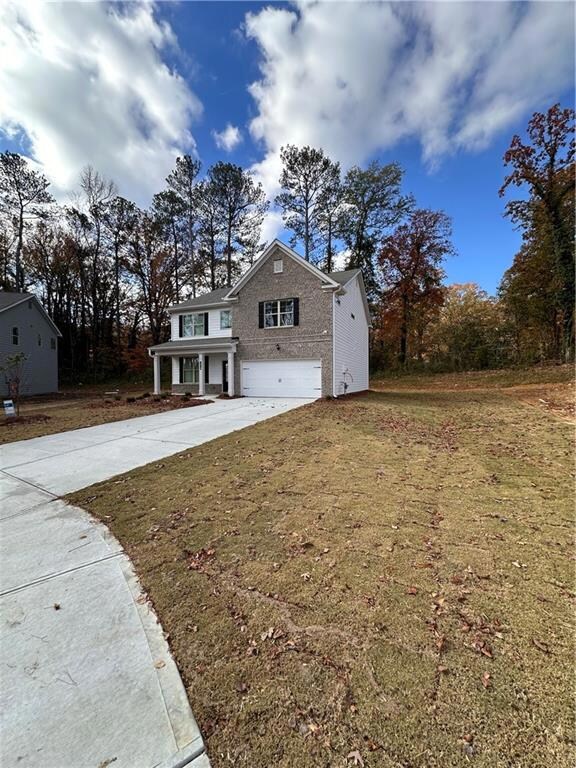 Long driveway to fit 4-6 cars.