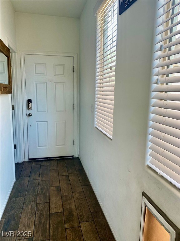 Foyer Doorway Entry (half bath on left) with dark