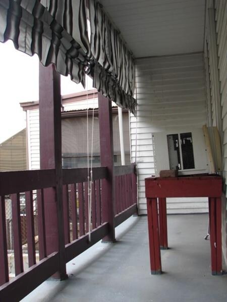 This property has been in the same family since the early 1900's and offers a rear porch and shares a courtyard with the home that sits behind it.