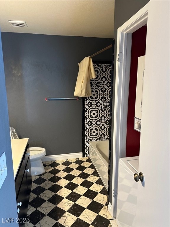 Bathroom featuring vanity and shower / bathtub com