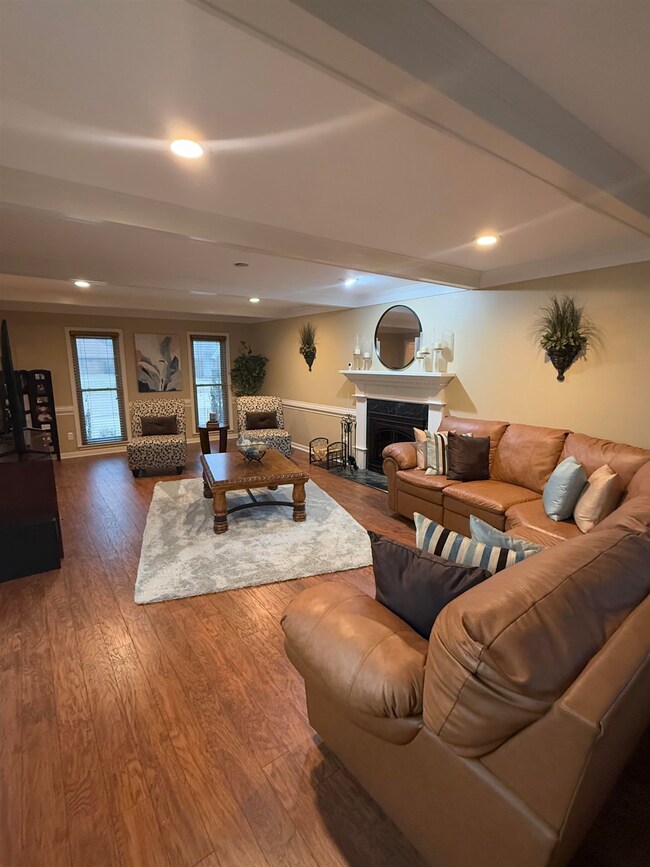 Living area with recessed lighting, wood finished 