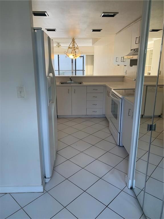 KITCHEN LOOKING INTO LIVING AREA