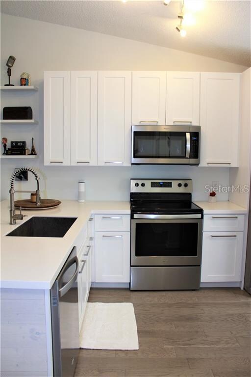 Open kitchen with all new appliances and extra lon