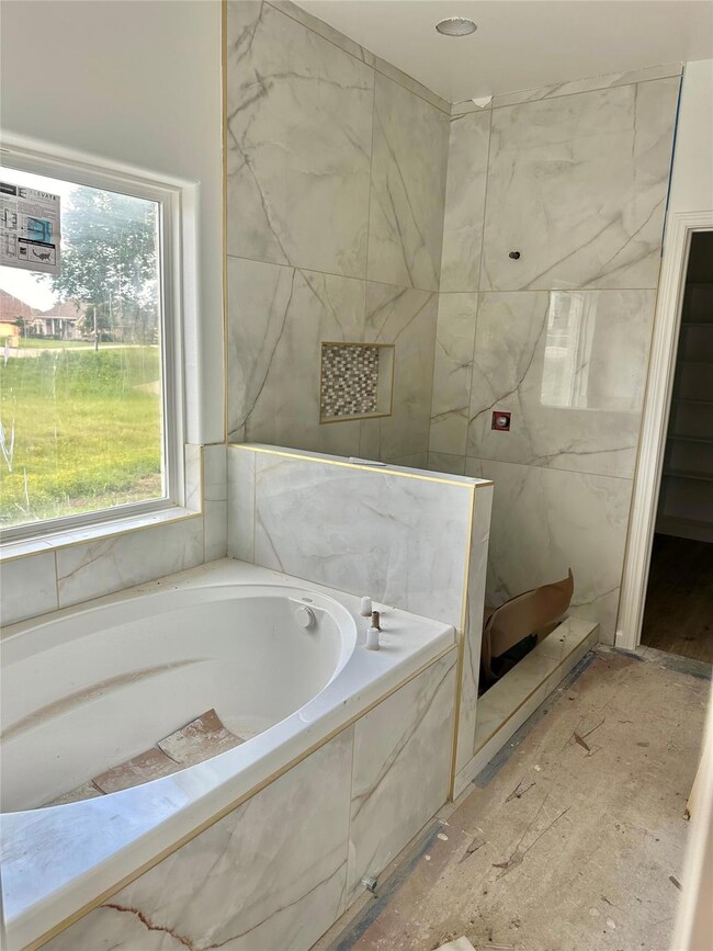 Bathroom featuring a wealth of natural light and a