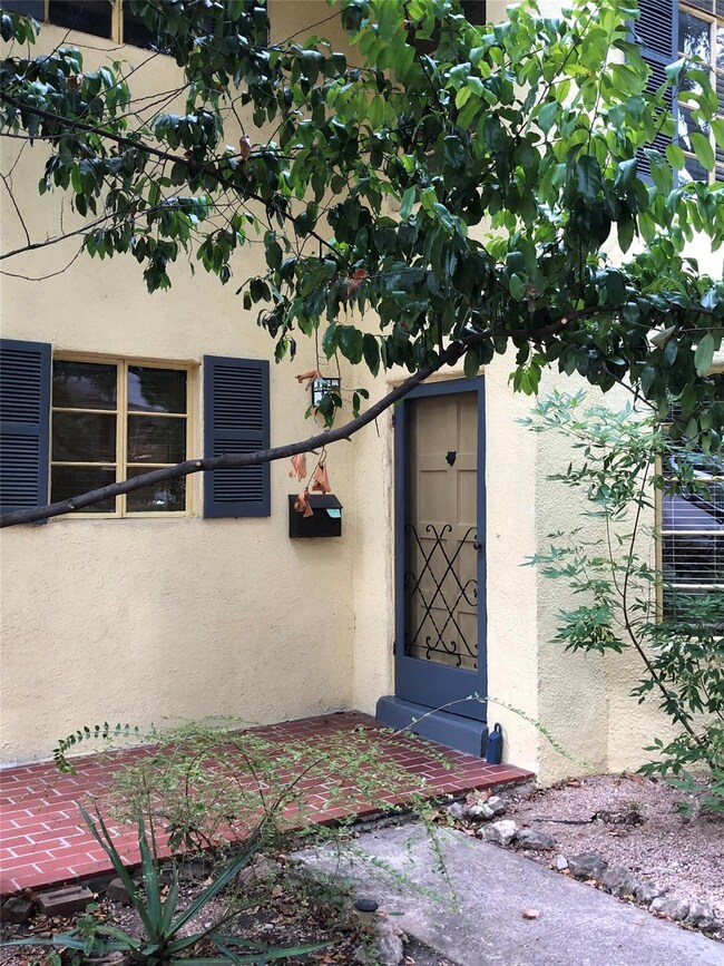 Property entrance with stucco siding