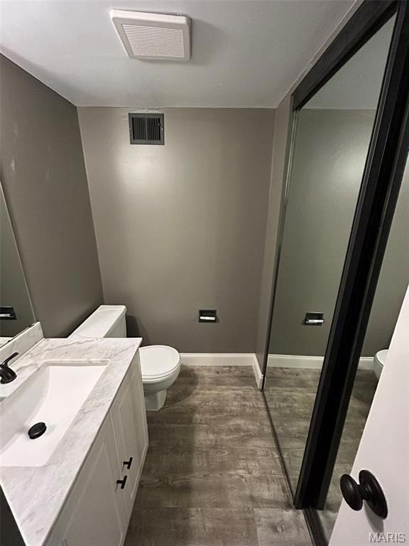 Bathroom with vanity and dark wood finished floors