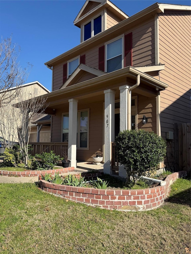 American foursquare style home with covered porch 