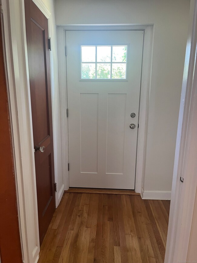 Front entrance has a new exterior door and coat cl