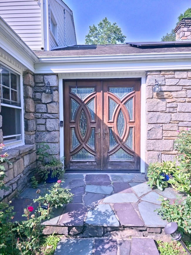 The front entry to the house by circular driveway.