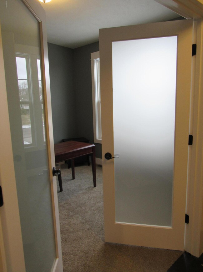 Double doors leading into flex room