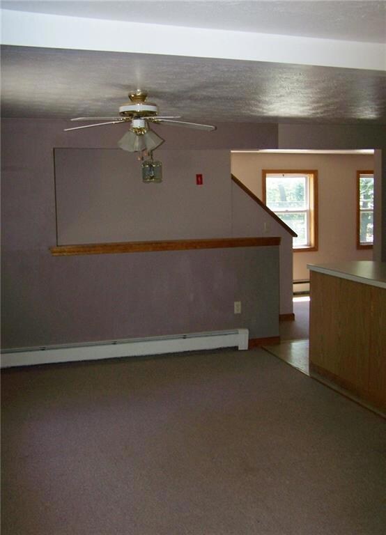 Living room entrance to kitchen and...