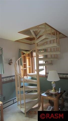 spiral staircase that leads to master bedroom.