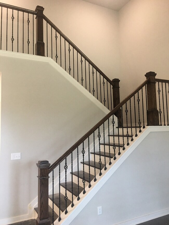 Glamorous metal spindles and hardwood staircase!