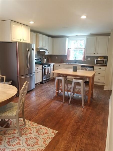 View of kitchen from eating area. Spacious and roo
