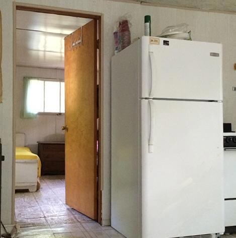 Kitchen with entrance to bedroom