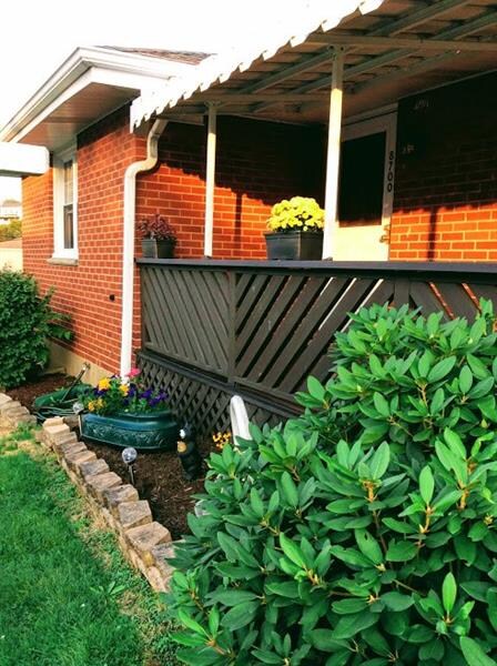Beautiful landscaping and wonderful covered front 