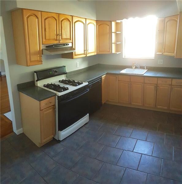Kitchen with newer cabinets and entry right off dr