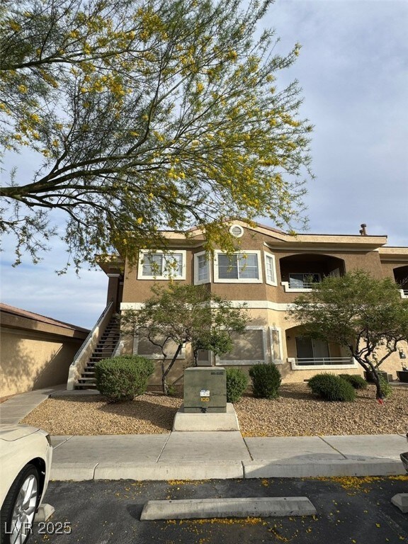 View of front of property featuring stairway and s