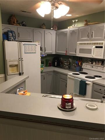 Great Kitchen space with gray cabinets