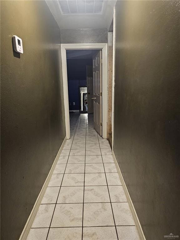 Hall with light tile floors