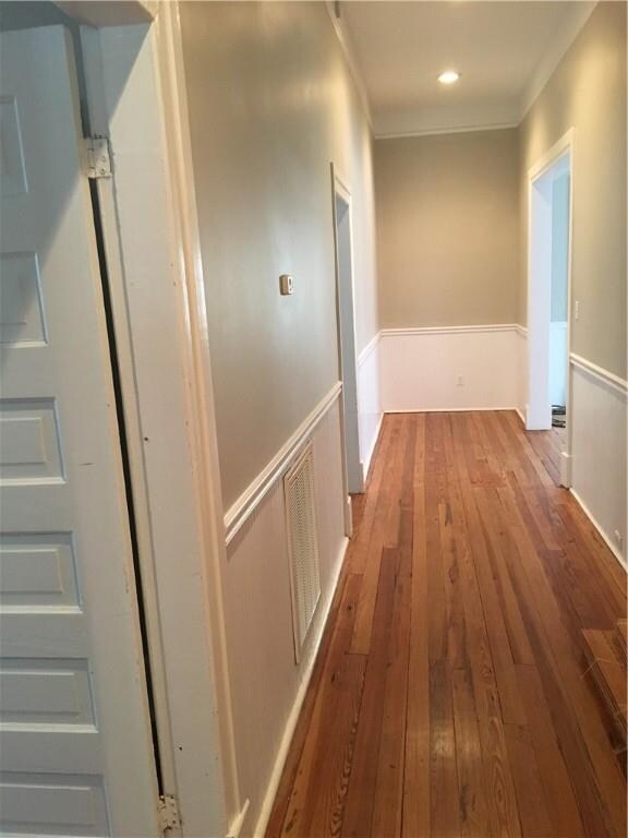 Wide hallway with bead board.