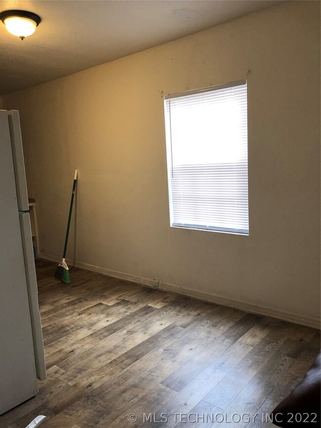 Eat-in area in kitchen. New flooring.