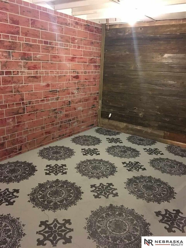 Great flex space with faux brick walls painted floor and barn wood walls! Like no other!