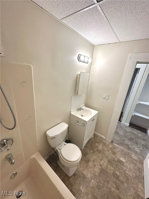 Full bathroom featuring vanity, a paneled ceiling, and bathing tub / shower combination