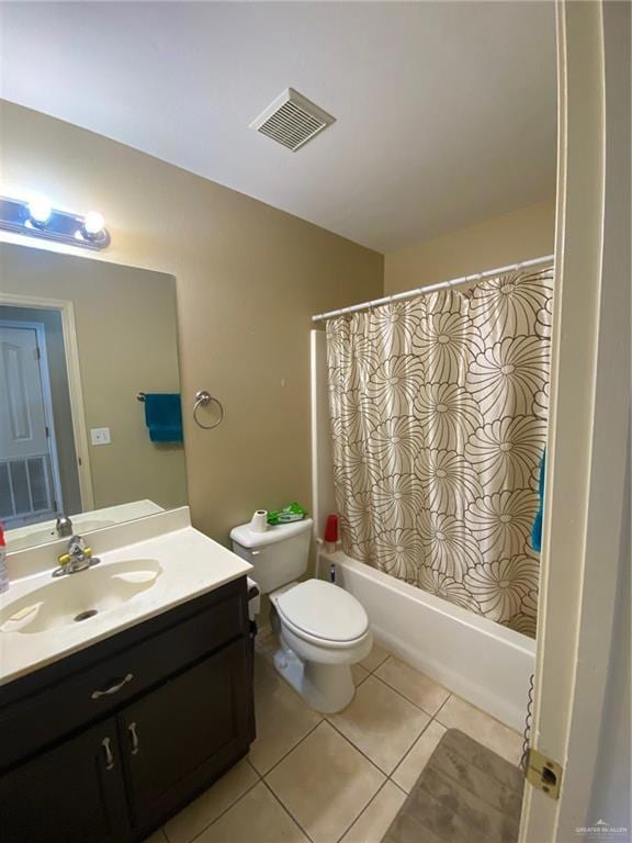 Full bathroom with vanity, toilet, shower / bathtub combination with curtain, and tile patterned flooring
