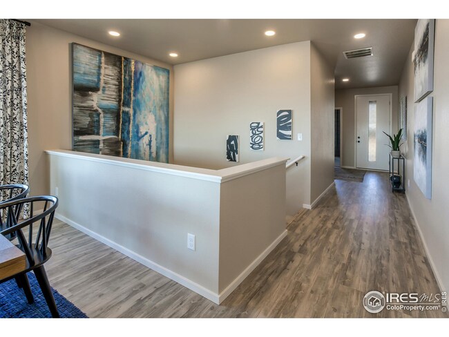 EXAMPLE PHOTO: ENTRYWAY AND STAIRWAY TO FINISHED BASEMENT
