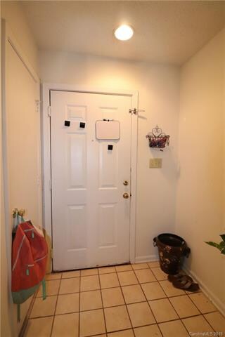 Foyer with tile flooring