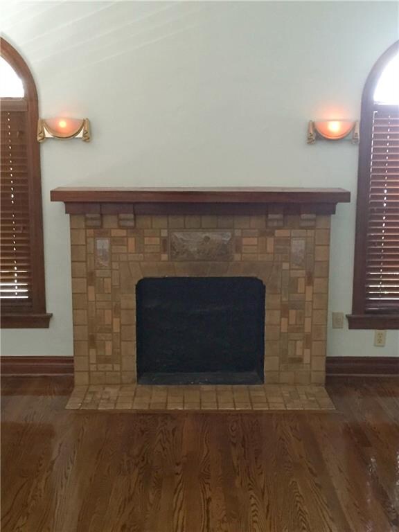 Sconces above fireplace are functional and add an air of elegance.