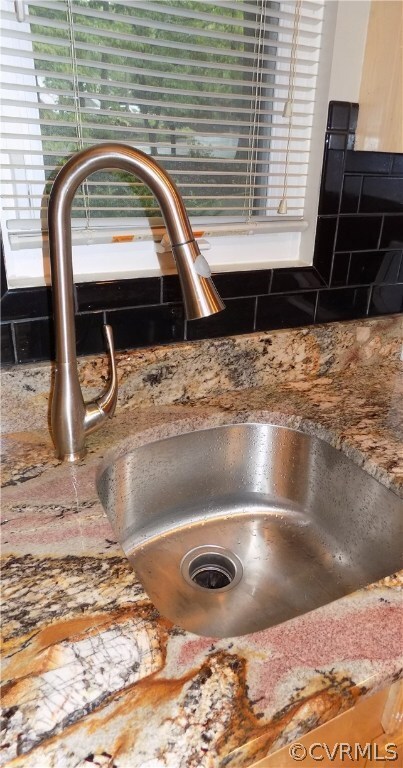 Under mount sink with brush nickel faucet