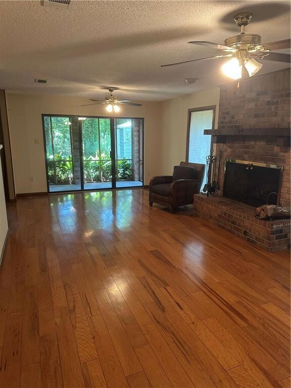 Den with fireplace/view to screen patio